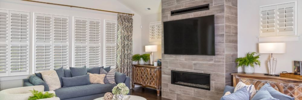 Plantation shutters in Show Low family room with fireplace