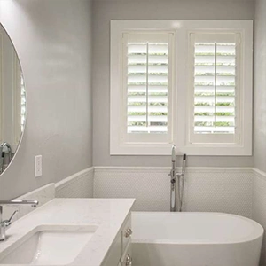 white studio shutters inside a white bathroom