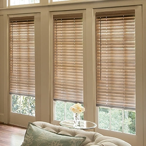 Light wooden blinds in a beige living room