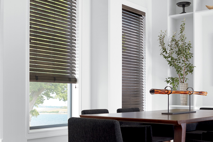 Capture the beauty of your home with faux-wood blinds. wooden blinds in a large modern living room