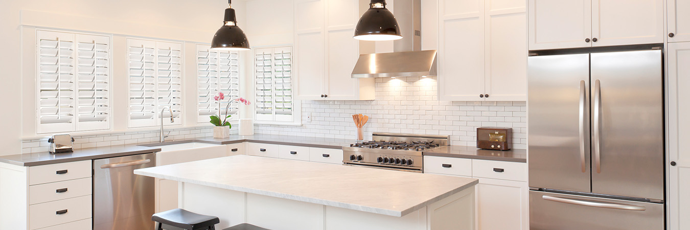 White polywood shutters in a large modern kitchen