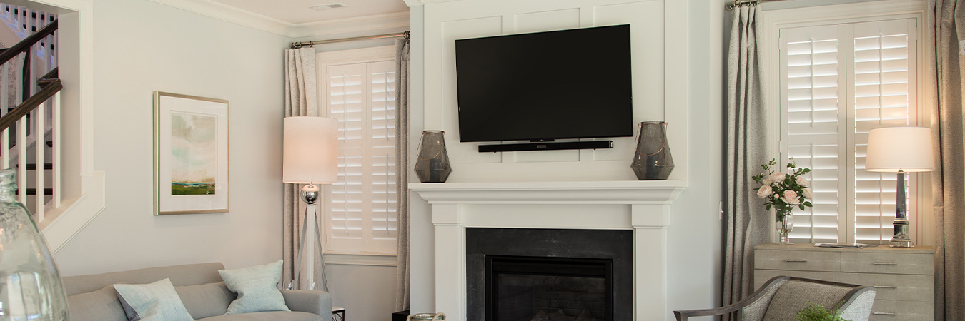 White Polywood shutters on windows in a living room