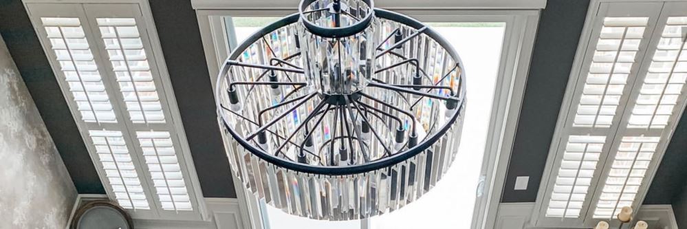 Photo credit: The Homes By Haley White Polywood shutters on long windows in a rustic dining room.